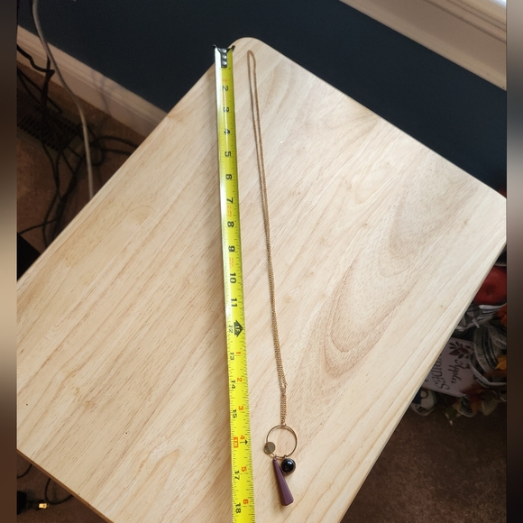 Necklace with a black charm and a purple cone-shaped rubber charm - Picture 4 of 4